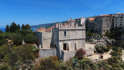 Obraz premium Aerial view of Santa Maria dell'Isola sanctuary on a rocky islet and the old town of Tropea with Tyrrhenian Sea in the background, Calabria, Southern Italy