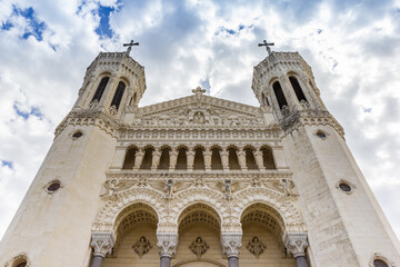 Front facade of the historic Notre Dame basilica in Lyon, France