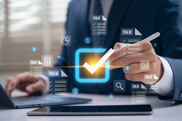 Professional businessman approving tax checklist with stylus on digital screen, managing financial...