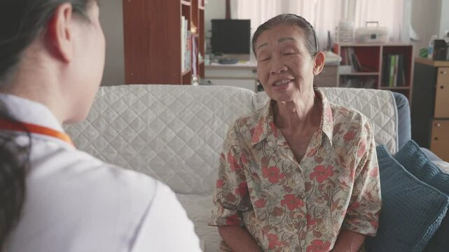 A heartwarming interaction between an elderly woman and a caregiver, showcasing the bond formed in a care environment. This scene highlights the importance of compassion and understanding across gener