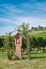 View of a wayside cross in the vineyards of Johannisberg in the Rheingau