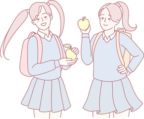 Two cheerful schoolgirls joyfully hold colorful fruits, symbolizing friendship and healthy eating habits