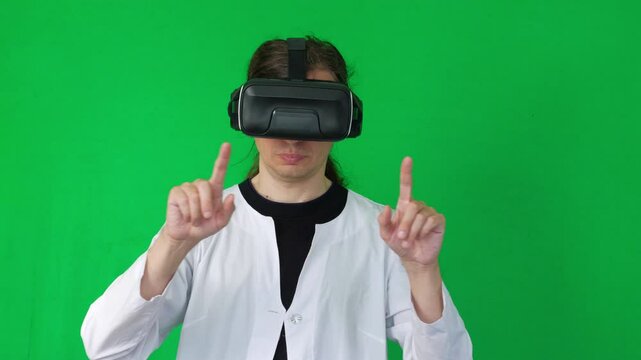  A mid-shot captures an immersive and futuristic mood as a person in a white lab coat and VR headset makes hand gestures, suggesting virtual reality interaction or gaming, green screen background