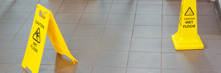 Caution wet floor cone safety notice at public stair