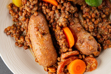Sausage with lentils and vegetables appetizer vegetable dish fresh tasty gourmet food background on the table rustic food top view copy space