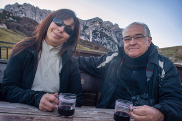Senior Couple Enjoying Mulled Wine in the Mountains
