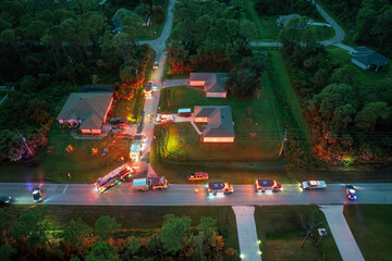 First responders arrived at fire alarm call ready to extinguish fire of burning house. Emergency...