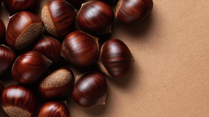 Chestnuts on kraft paper surface, Autumn nuts in natural arrangement, Perfect for seasonal food or rustic design themes