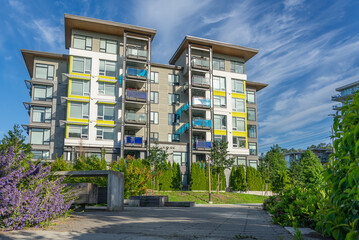 Modern apartment building with nice summer landscape in Vancouver, Canada, North America. Day time...