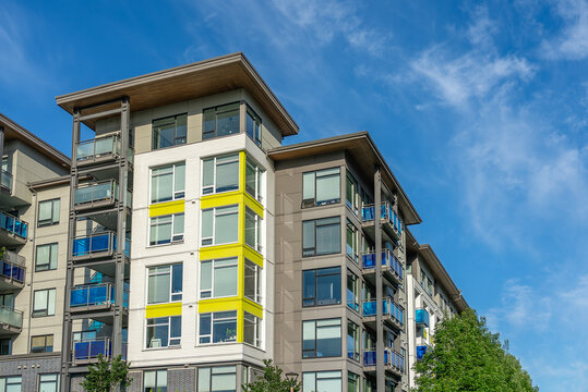 Modern apartment building with nice summer landscape in Vancouver, Canada, North America. Day time on June 2025.