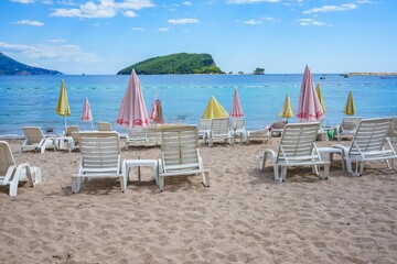 Budva Beach with Sunbeds and Umbrellas on the Adriatic Sea, Montenegro Coastline