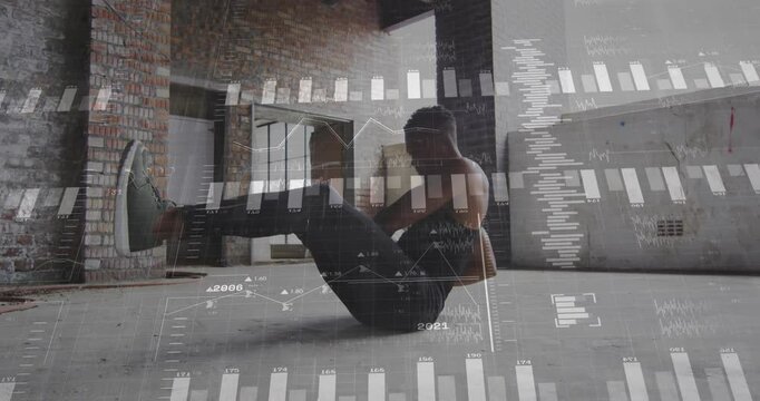 Man balancing V-sit holding medicine ball twisting torso left right updating fitness data charts