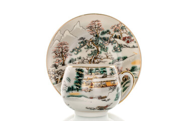 Ceramic cup with saucer isolated on white background, close-up.