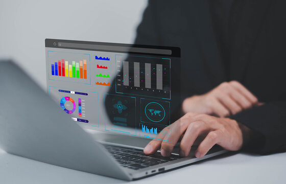 Analyst using laptop to analyze data. shows a dashboard chart for business data analysis and metrics connected to the database for digital technology finance, Analytics concept, Social network, operat