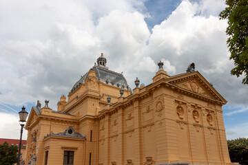 The magnificent Art Pavilion in Zagreb, Croatia, stands majestically under a cloudy sky