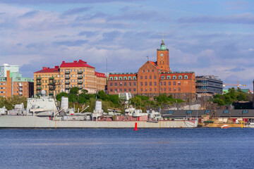 Gothenburg city skyline with HswMS Halland class destroyer Smaland and Navigation school on sunny day, Sweden
