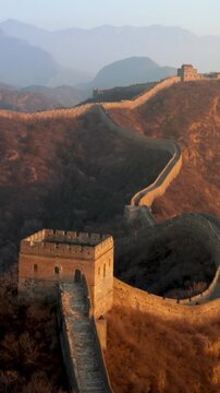 Flying over the Great Wall of China at sunrise. Vertical Video,