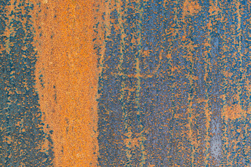 Abstract grunge texture of an old rusty metal surface with heavy corrosion and peeling blue paint. Ideal background for design purposes.