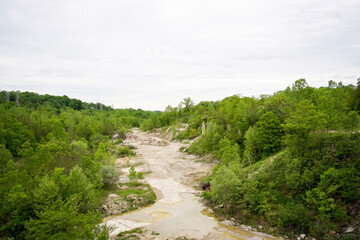 Eroded Quarry Valley Surrounded by Green Forest