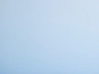 A plain light blue wall mockup suitable for interior design presentations. The surface is smooth with minimal texture, ideal for showcasing artwork or decor.