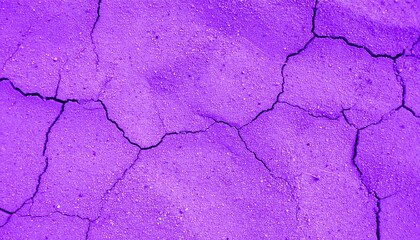 Purple cracked earth texture background.