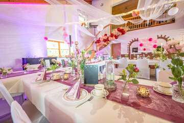 Wedding decor. Close up of a wedding table decoration with white and pink flowers and candles Wedding floristic concept