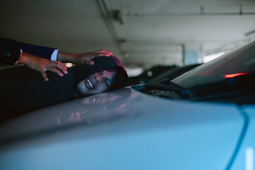 Tension builds as a dark encounter unfolds in a dimly lit parking garage at night