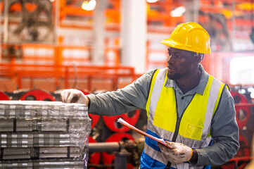 African workers working happy aftter working of maintenance machine in heavy industrial factory