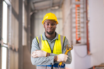 African workers working happy aftter working of maintenance machine in heavy industrial factory
