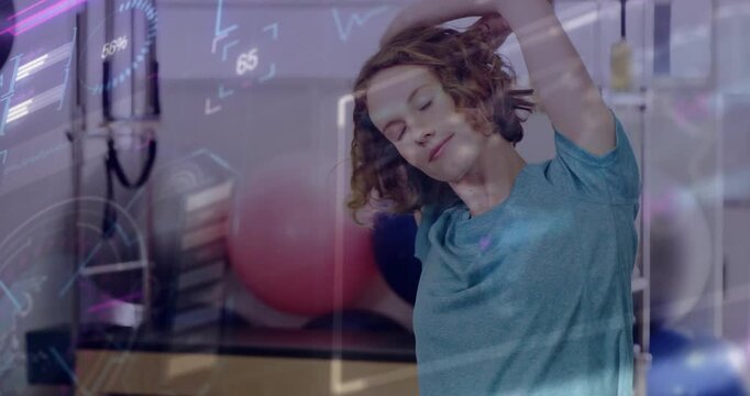 Woman lifting arm to start side-stretch in Pilates studio with fitness overlay tracking flexibility