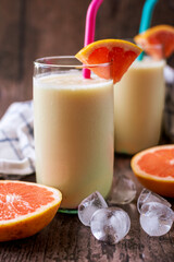 Grapefruit smoothie in a tall glass.