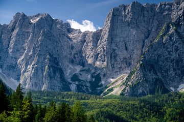 Morning view of the high peaks of the Julian Alps, Udine province, Italy.	
