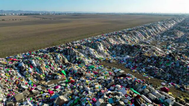 arafed pile of plastic bottles and other garbage in a field