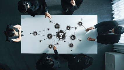 Business Team Collaborating on Digital Strategy at Conference Table with Data Visualization and...