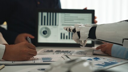 A dynamic business meeting showcases a robot assistant engaging with professionals in a modern...