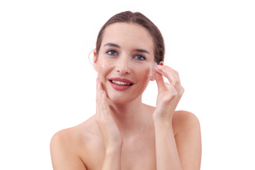 Portrait of happy young woman with a natural, no makeup look, applying silicone under eye patches and smiling while looking at the camera. Skincare concept for dark circles, isolated white background