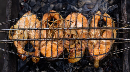 Savor the incredibly delicious grilled salmon steaks accompanied by perfectly cooked onions, a true...