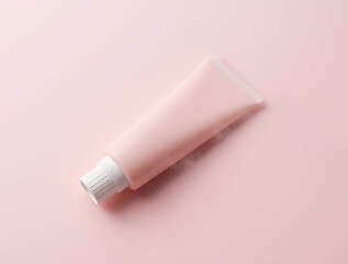 pink cream tube on pink background