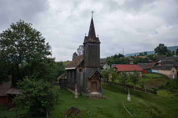 Old Wooden Church with Steeple and Cross