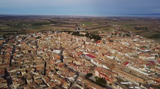 Aerial drone view over the catalan town of Arbeca, Les Garrigues, Lleida, Catalonia. Typical olive grove land