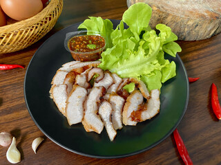 Grilled Pork Neck with Spicy Thai Dipping Sauce and Fresh Lettuce – Traditional Thai Food on...
