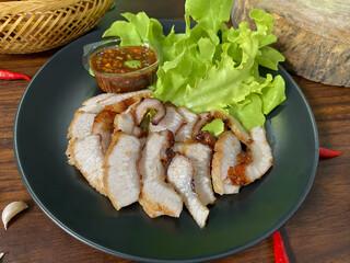 Grilled Pork Neck with Spicy Thai Dipping Sauce and Fresh Lettuce – Traditional Thai Food on...