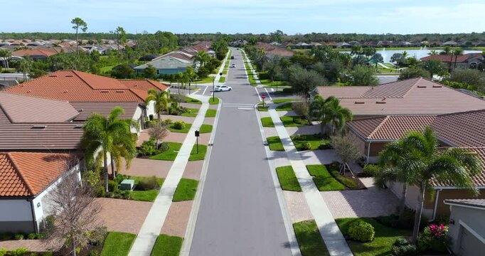 Large residential homes in southwest Florida gated community. American houses in rural US suburbs