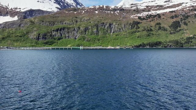 4k aerial video footage, flying across the head of "Passage Canal" from Whittier to  area around Glacier Creek Terminal - NCL Whittier Cruise Ship Terminal with pier,  located on Kenai Peninsula 