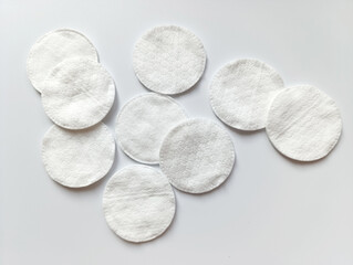 Cotton pads arranged on a white background for beauty and personal care routines