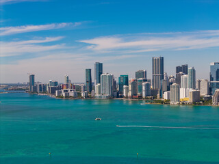 Fototapeta premium Skyscraper in downtown city. Cityscape skyline. Brickell building in Miami downtown. Brickell skyline and skyscraper architecture. City skyline. Miami from Brickell Key in Florida. Travel destination