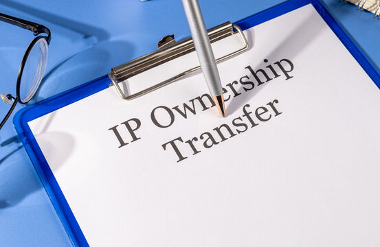 IP Ownership Transfer Form on Clipboard – Intellectual Property Law Theme