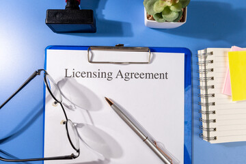 Licensing Agreement Form on Clipboard – Intellectual Property Law Office Scene