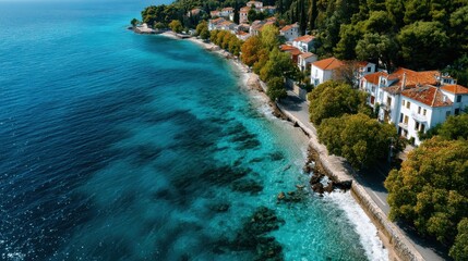 A lush coastal walking path runs along crystal blue waters and vibrant greenery, inviting open air exploration and a refreshing escape to nature's peaceful embrace.
