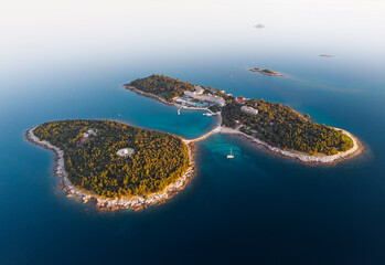 Stunning aerial view of Rovinj's islands at sunrise showcasing natural beauty and tranquility